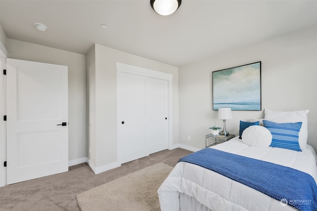 carpeted bedroom featuring a closet