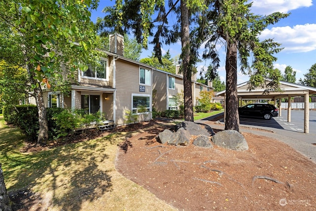 view of front of property with a carport