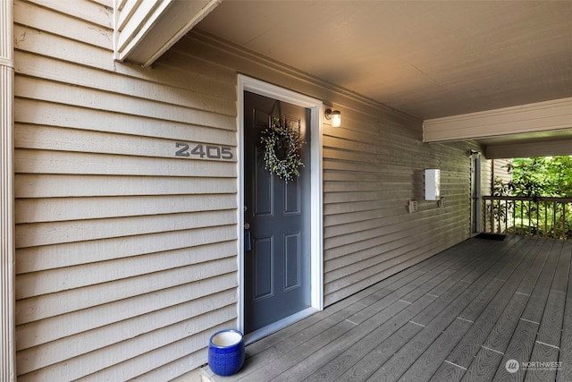 view of exterior entry featuring a porch