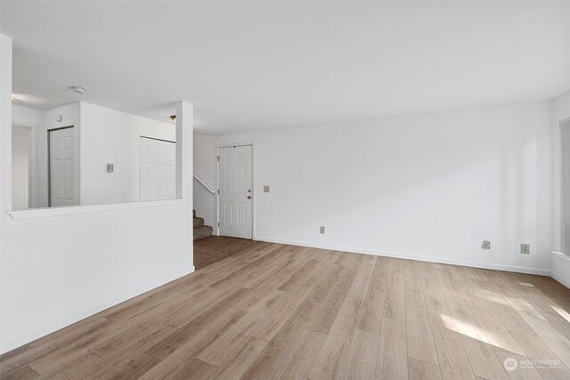 spare room with light hardwood / wood-style flooring