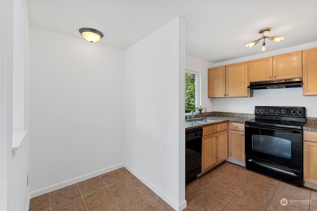 kitchen with sink, light tile patterned floors, light brown cabinetry, and black appliances