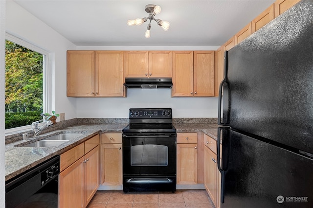 kitchen with sink, black appliances, light stone countertops, light tile patterned flooring, and light brown cabinets