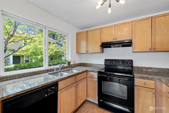 kitchen featuring light brown cabinetry, sink, light tile patterned floors, light stone countertops, and black appliances