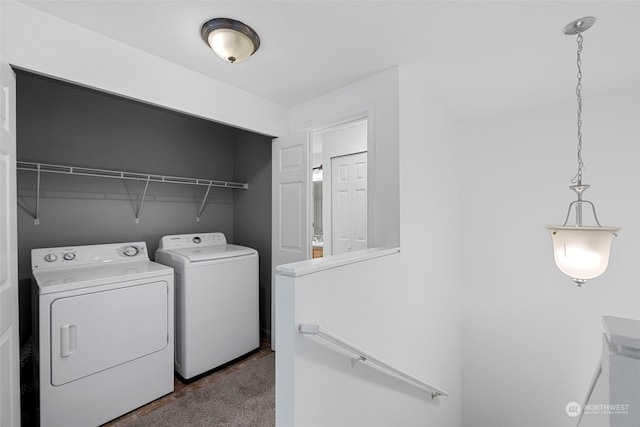 clothes washing area featuring carpet and washing machine and clothes dryer