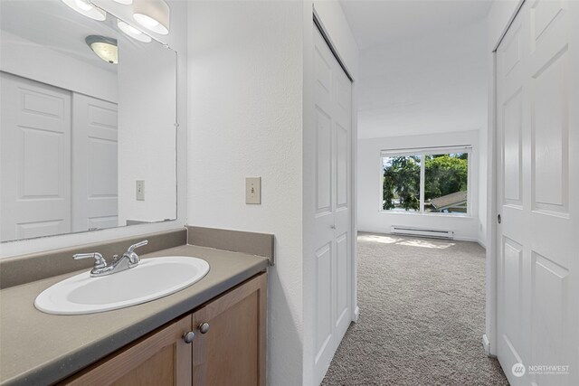 bathroom featuring vanity and a baseboard radiator