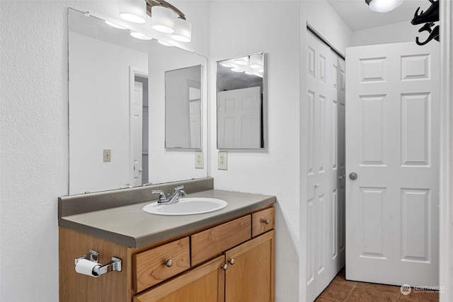 bathroom with tile patterned floors and vanity