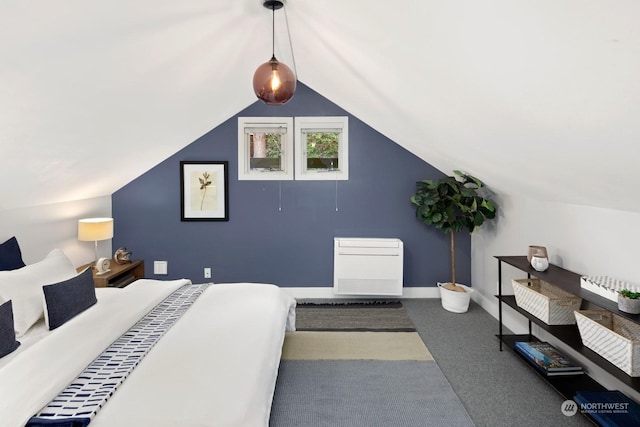 bedroom featuring lofted ceiling and carpet flooring