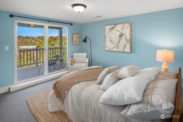 carpeted bedroom featuring access to exterior