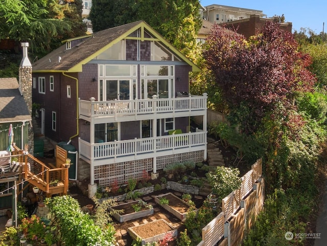 back of property featuring a balcony