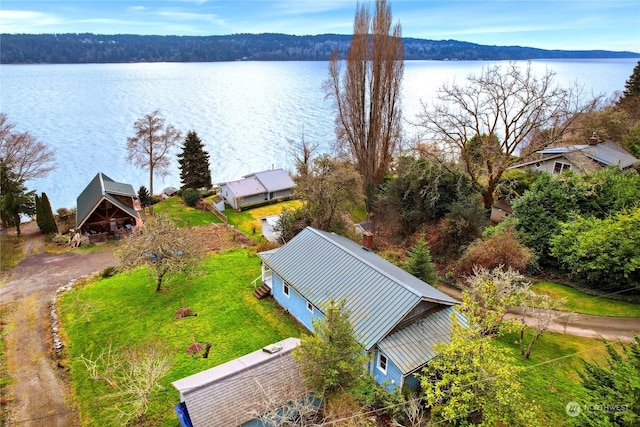 birds eye view of property featuring a water view