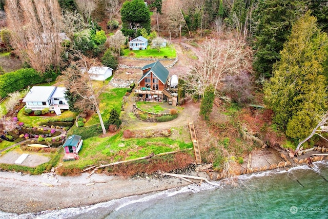 birds eye view of property with a water view