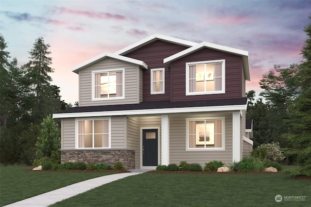 view of front facade featuring stone siding and a front lawn