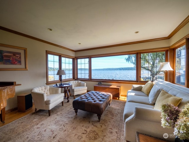 living room featuring hardwood / wood-style floors, ornamental molding, and a water view