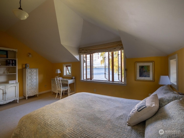 carpeted bedroom with vaulted ceiling