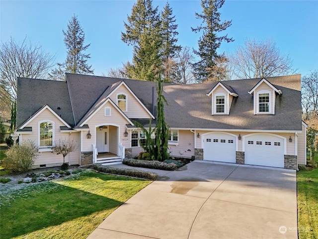 view of front of house with a garage and a front yard