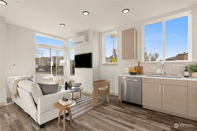 living room featuring an AC wall unit, indoor wet bar, dark hardwood / wood-style flooring, and a healthy amount of sunlight