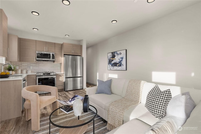 living room featuring light wood-style floors and recessed lighting