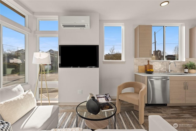 living room featuring a wall mounted air conditioner and wood finished floors