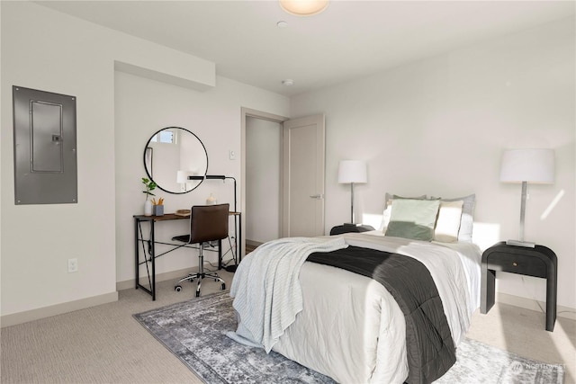 carpeted bedroom featuring electric panel and baseboards