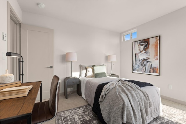 bedroom with carpet and baseboards