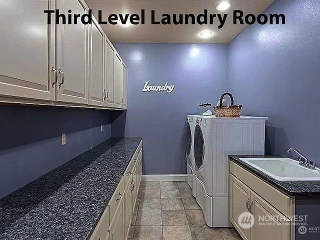 laundry area with cabinets, sink, and washer and dryer