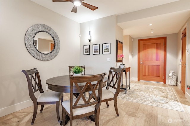 dining area featuring ceiling fan and light hardwood / wood-style flooring