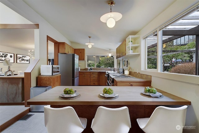 dining area featuring lofted ceiling