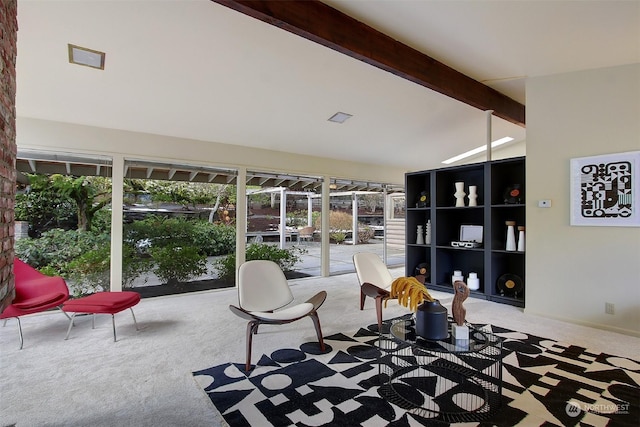 interior space with lofted ceiling with beams and carpet