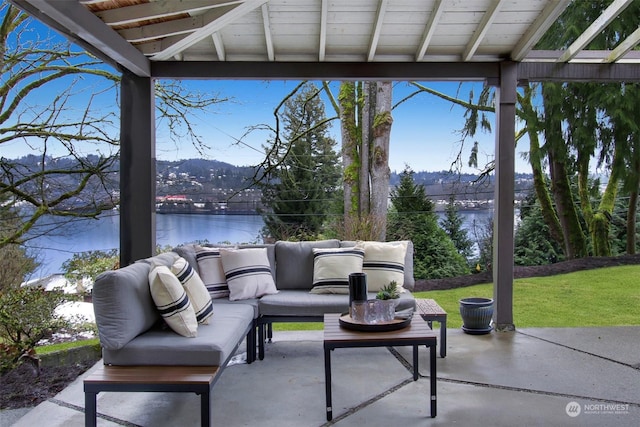 view of patio / terrace featuring an outdoor living space and a water and mountain view