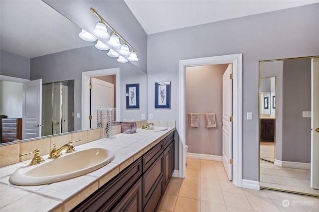 bathroom with tile patterned floors, toilet, and vanity