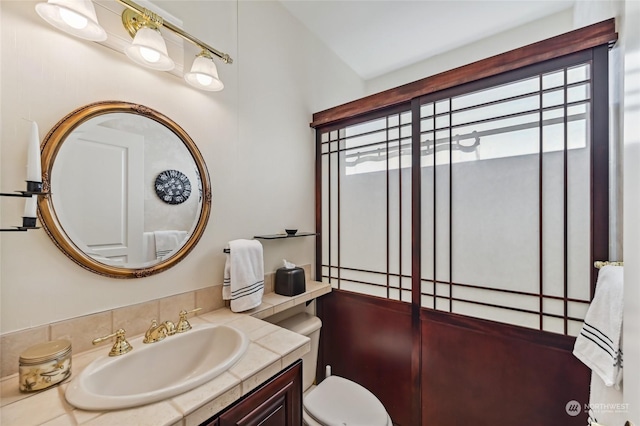 bathroom with vanity and toilet