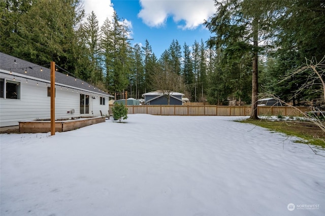 view of yard covered in snow