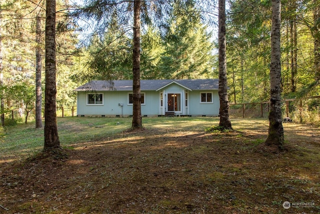 ranch-style house featuring a front yard