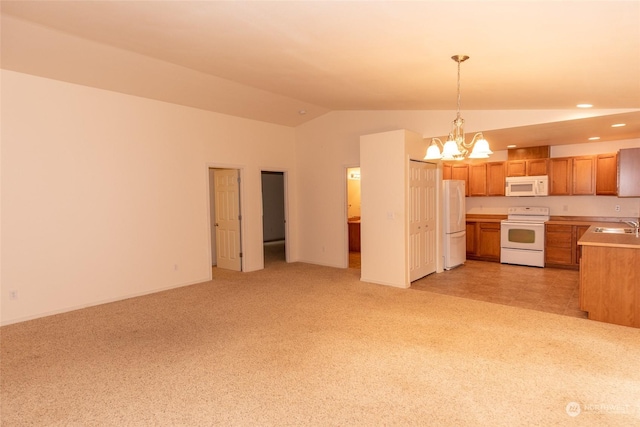 kitchen featuring white appliances, an inviting chandelier, hanging light fixtures, vaulted ceiling, and light colored carpet