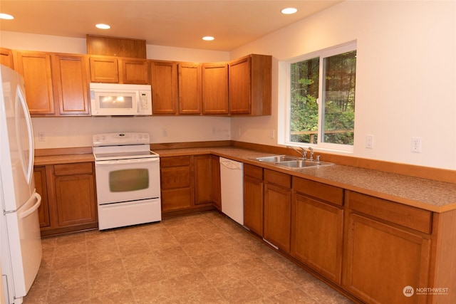 kitchen featuring sink and white appliances