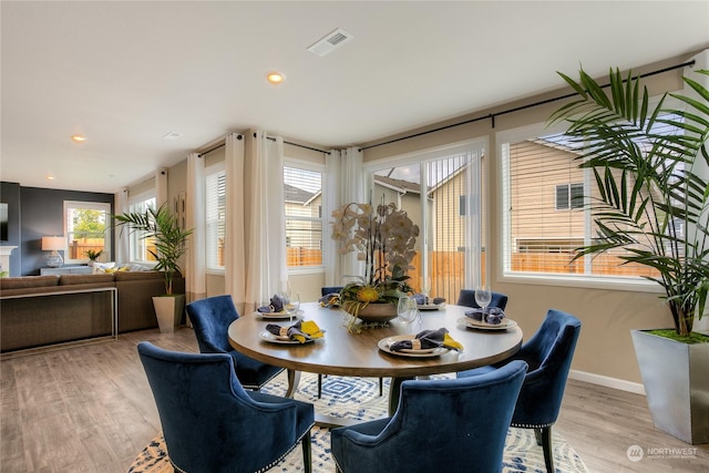 dining area with light wood-type flooring