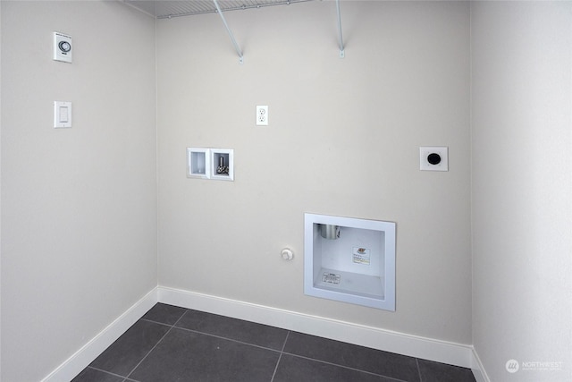 clothes washing area with gas dryer hookup, dark tile patterned flooring, hookup for a washing machine, and hookup for an electric dryer