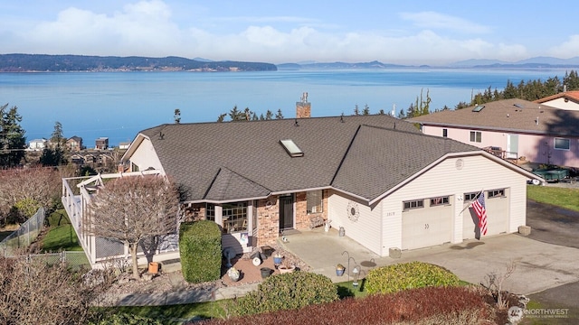 view of front of house featuring a water and mountain view