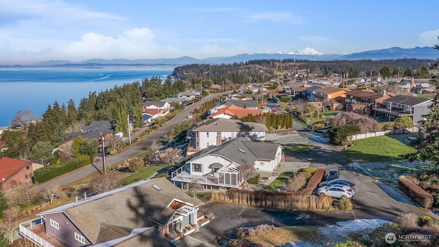 bird's eye view with a water and mountain view