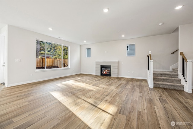 unfurnished living room featuring light hardwood / wood-style floors