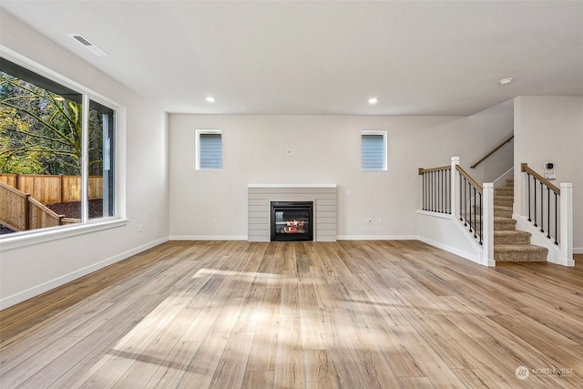 unfurnished living room featuring light wood-type flooring