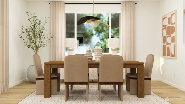 dining space featuring light wood-type flooring