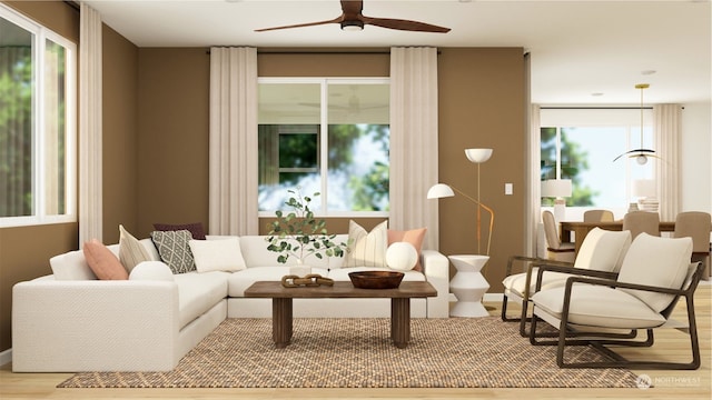 living room with a healthy amount of sunlight and ceiling fan