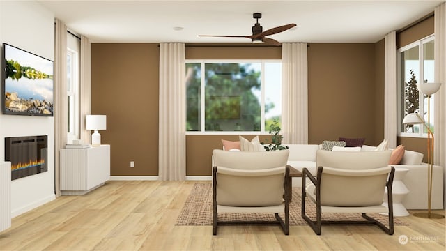 interior space featuring ceiling fan, a healthy amount of sunlight, and light wood-type flooring