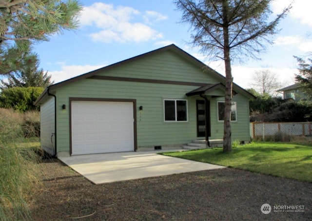 view of front of property with a garage and a front lawn