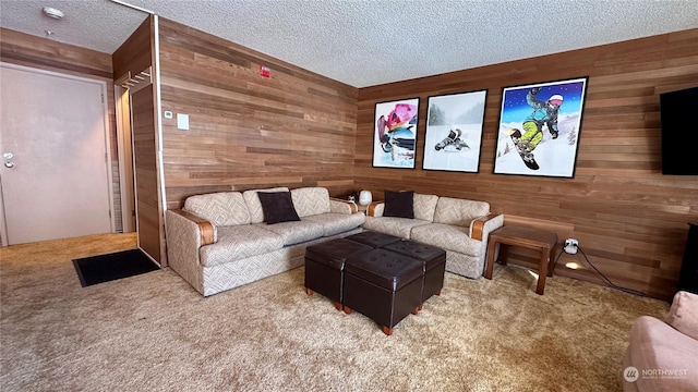 carpeted cinema featuring a textured ceiling and wooden walls