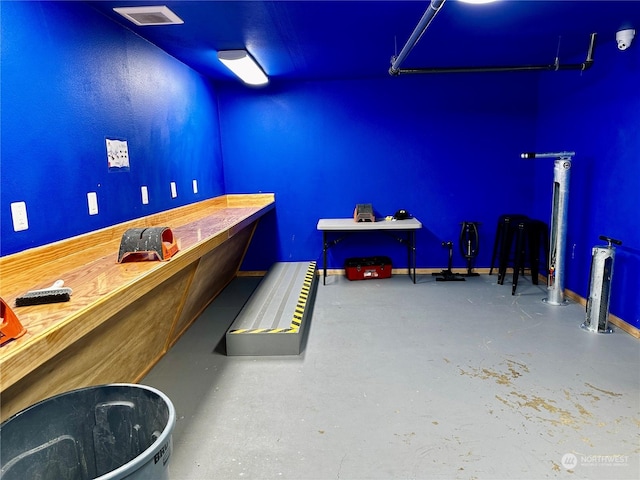 playroom with concrete flooring