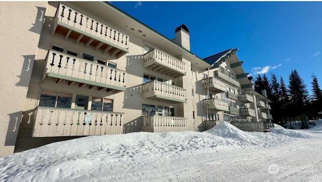 view of snow covered property