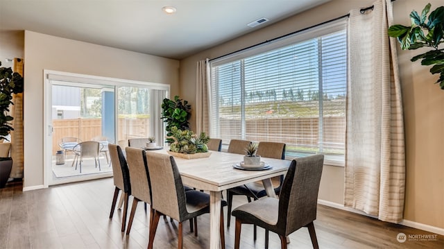 dining area with hardwood / wood-style flooring