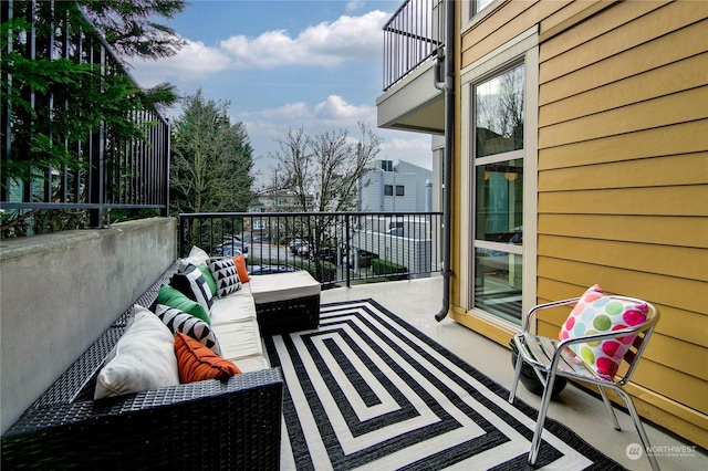 balcony with an outdoor hangout area